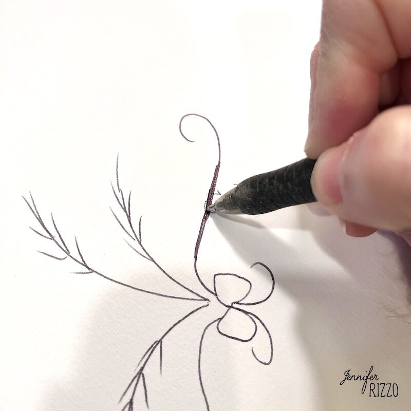 A hand uses a fine-tip pen to draw a detailed botanical design on white paper, demonstrating how to transfer a repeating image or pattern with a pencil.