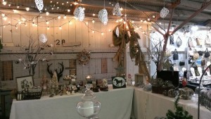 Christmas display at a flea market booth with lights