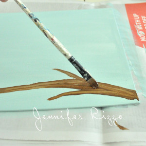 Use a dark brown to line the branch painting