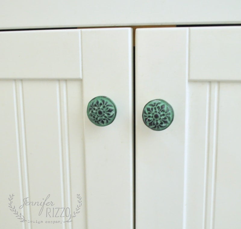 New blue bathroom knobs on a white vanity
