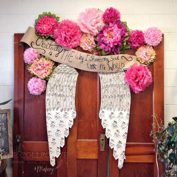 Angel wing floral selfie wall idea at The Collective lhe + Makery