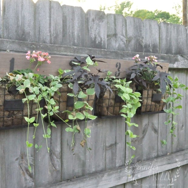 Fun farmhouse fence planter DIY from Jennifer Rizzo