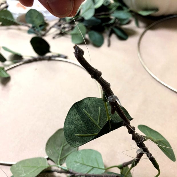 Faux eucalyptus wreath on gold ring Jennifer Rizzo