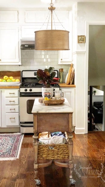 Jennifer Rizzo kitchen brass drum shade light over island