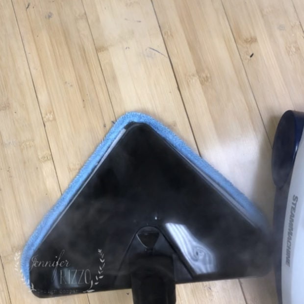 Cleaning a floor with paint with a steam cleaner