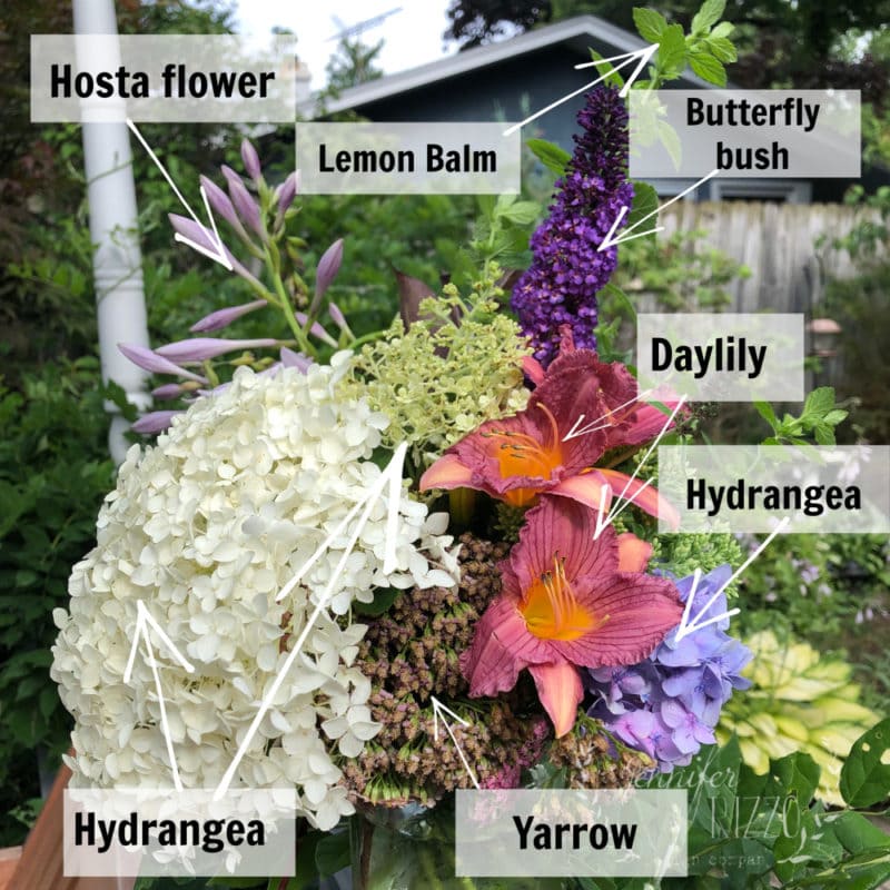 Make backyard bouquets with this arrangement featuring Hosta flowers, Lemon Balm, Butterfly bush, Daylilies, Hydrangeas, and Yarrow.