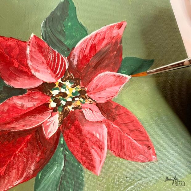 Add white paint to highlight the poinsettia bract edges of the poinsettia