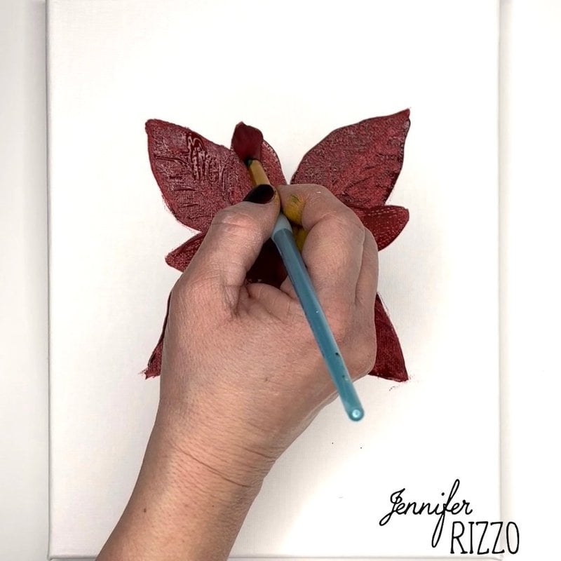 Paint the second layer of bracts with straight red paint on a poinsettia flower