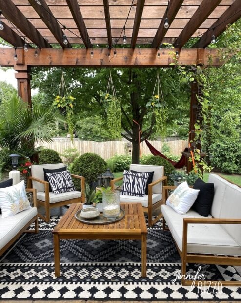 Outdoor seating with pergola and hanging plants