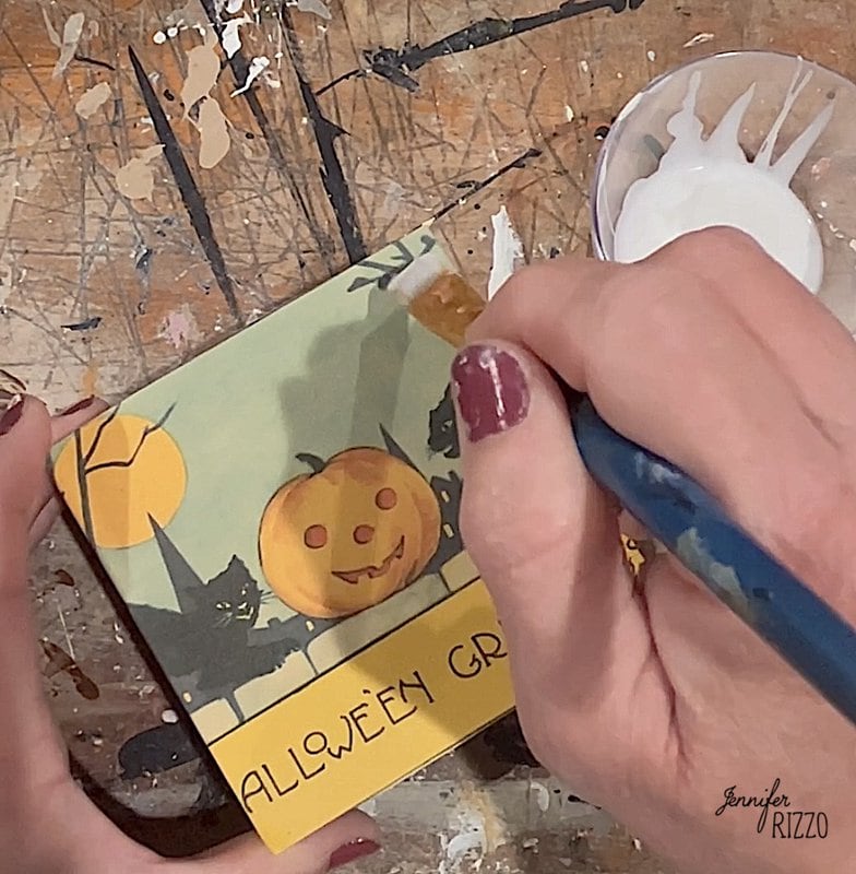 Brush decoupage medium to the surface of the halloween image