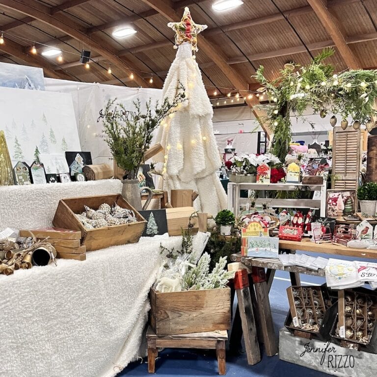Show display with vintage boxes and a sherpa tree