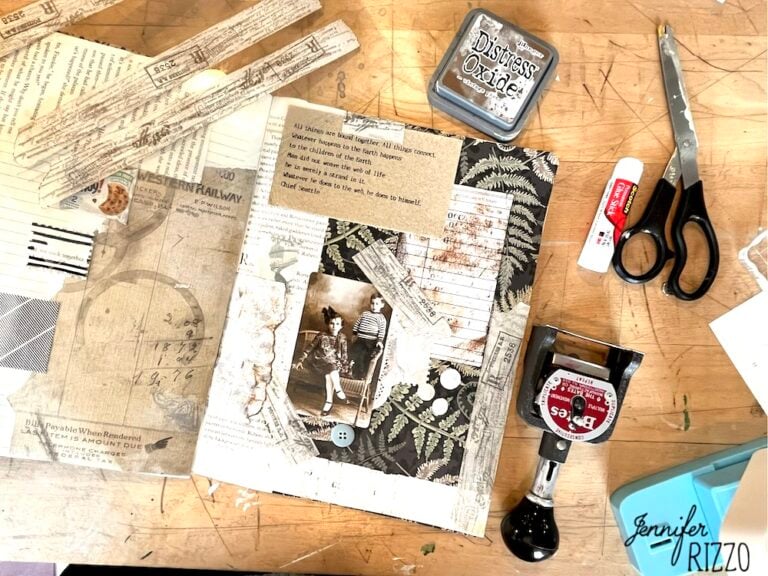 Scrapbook page in progress on a wooden table with vintage papers, photograph, scissors, ink pad, glue stick, date stamp, and crafting tools nearby—perfect inspiration for How to Make Your Own Custom DIY Washi Tape.