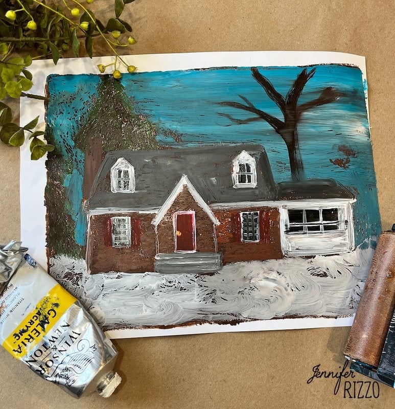 Painting of a house with a red door, surrounded by snow and a bare tree. Art supplies and a plant are partially visible at the edges.