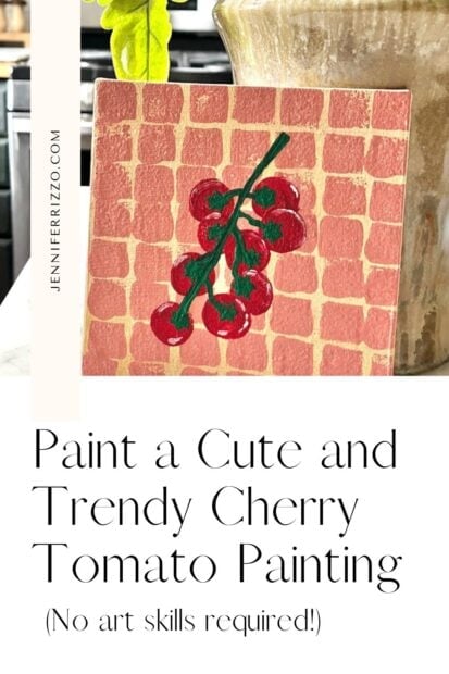 A small painting of cherry tomatoes on a vine, set against a grid-patterned pink background, displayed near a potted plant.