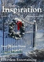 A snow-covered iron gate decorated with a wreath and red bow stands open; magazine cover text includes "Inspiration," winter-themed articles, and features about Jennifer Rizzo.