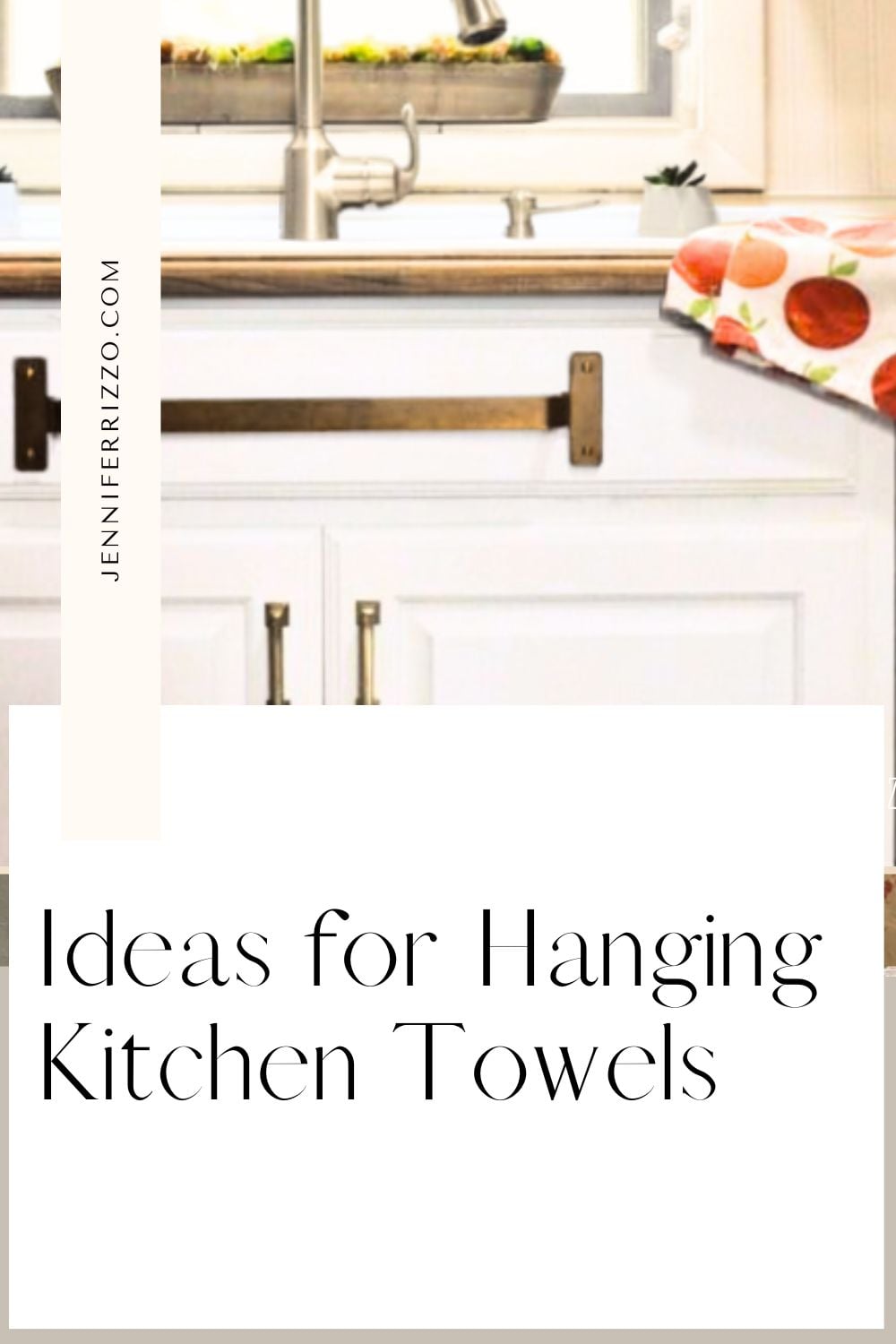 A white kitchen cabinet with a towel bar mounted on the front holds a kitchen towel under the countertop next to a sink. Text reads: “Ideas for Hanging Kitchen Towels” – the perfect inspiration for stylish and practical towel storage.