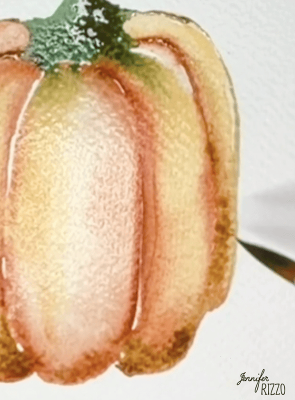 Watercolor painting of an orange pumpkin being outlined with a paintbrush on textured paper; the artist’s signature, Jennifer Rizzo, is visible.