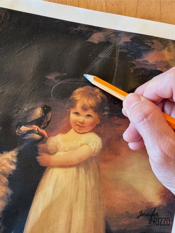 A hand uses a pencil to draw on a printed painting of a young child in a white dress standing with a black dog.
