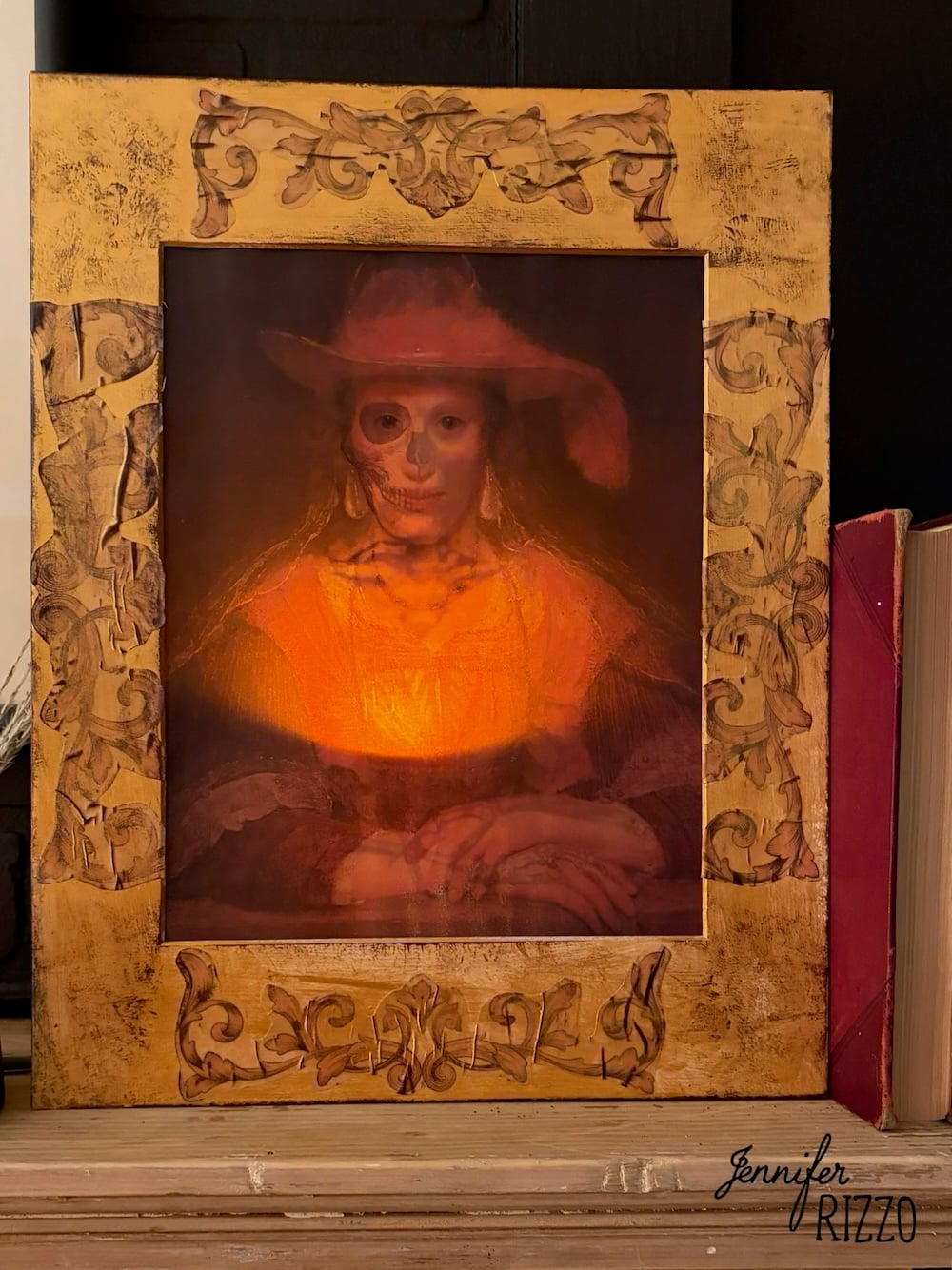 A framed portrait shifts from a woman in a hat to a skeletal face, blending classic and eerie elements, set on a wooden surface next to books.