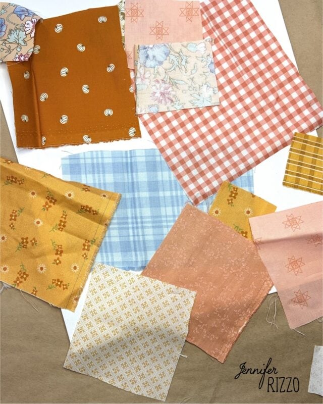 Assorted fabric swatches in various patterns and colors, including plaid, floral, solid, and geometric designs, are arranged on a white background. The text “Jennifer Rizzo” appears in the corner.