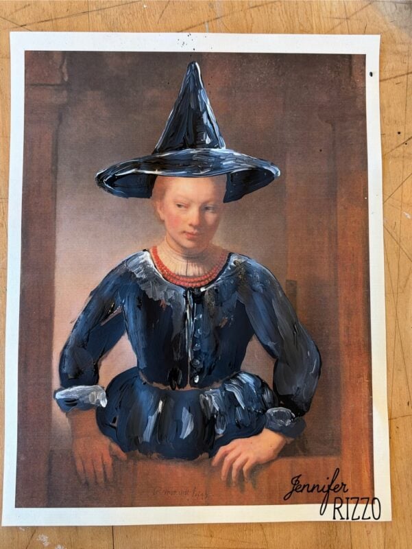 A classical portrait print has been painted over to give the woman a blue dress and black witch hat. “Jennifer Rizzo” is signed in the bottom right corner.
